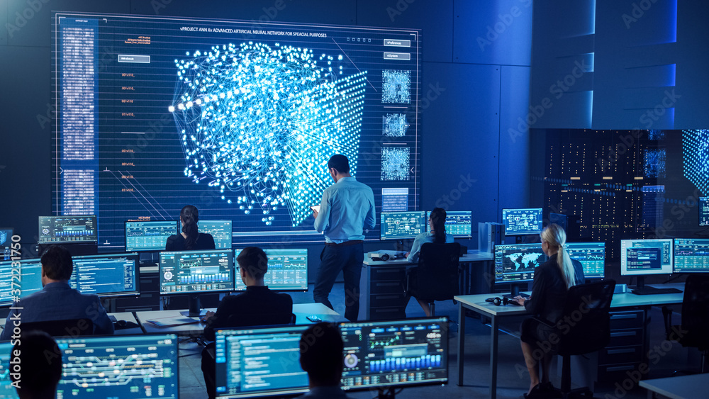 Team of Professional Computer Data Science Engineers Work on Desktops ...