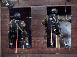 Wall Mural - Special forces soldiers storm the walls