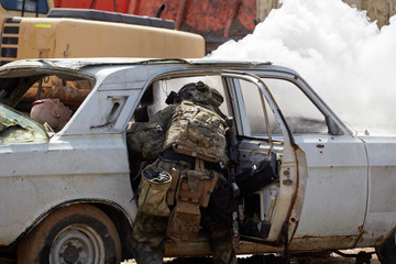 Wall Mural - Special forces soldiers storm the car