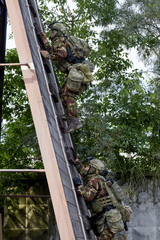 Wall Mural - Special forces soldiers storm the walls