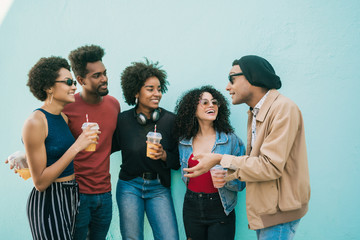 Wall Mural - Multi-ethnic group of friends having fun together.