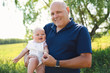 © Louis-Paul Photo - grandfather spending time with little baby girl during the day