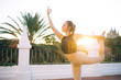 © GalakticDreamer - Sensual woman practicing yoga during sundown