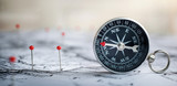 Fototapeta Mapy - Magnetic old compass on world map.Travel, geography, navigation, tourism and exploration concept background. Macro photo. Very shallow focus.