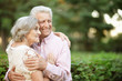 © aletia2011 - Portrait of smiling senior couple smiling in park