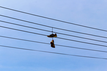 high voltage power lines with hanging slippers