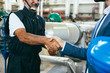 businessman and worker handshake indoor industry plant