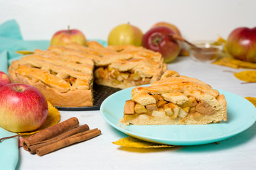 Wall Mural - Autumn baking concept. Cooking baking traditional autumn Apple pie, light background copy space. homemade sweet dessert with apples and cinnamon