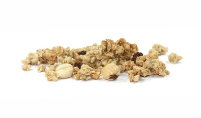 Wall Mural - Pile of granola from above isolated on a white background. CRUNCHY hazelnut muesli isolated.