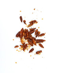 Wall Mural - Dried red hot chilli pepper isolated on white background. Cayenne pepper. Pile crushed red cayenne pepper, dried chili flakes and seeds isolated on white background.