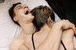 © Vladimir Tsarkov/Stocksy - couple have fun in bed