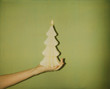 © JImena Roquero/Stocksy - Old Polaroid photo of Christmas tree shaped candle
