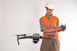 © Grispb - Geodesy using a drone. The surveyor launches a quadrocopter for mapping work. Land surveying using a drone. Surveyor with a drone.
