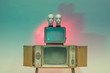 © Igor Madjinca/Stocksy - light experiment with retro TVs and doll heads