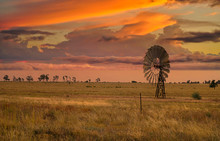 Australian Sunset With A Windmill
