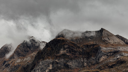 Landscape photography about the color of the mountain in autumn, with wonderful rocky mountains at behind.