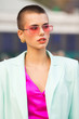 © Screen moment/Stocksy - Portrait of Beautiful short-haired woman with beautiful makeup in pink glasses