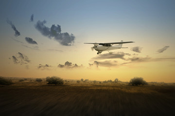 Aircraft flying in the air above the landscape