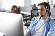 © opolja - Young handsome male customer support phone operator with headset working in call center.