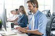 © opolja - Young handsome male customer support phone operator with headset working in call center.