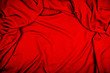 Dramatic closeup folds of dark red or wine red drapery (with copyspace for text)