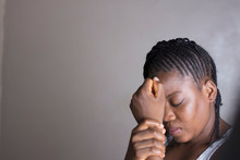 A Young African Girl In Pains, Crying.  