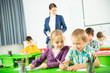 © JackF - Portrait of schoolchildren sitting in classroom and chatting during lesson. High quality photo