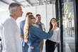 © opolja - Business people meeting at office and use post it notes to share idea. Brainstorming concept. Sticky note on glass wall.