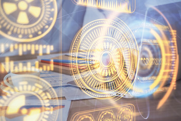  Technology theme hologram with man working on computer on background. High tech concept. Multi exposure.