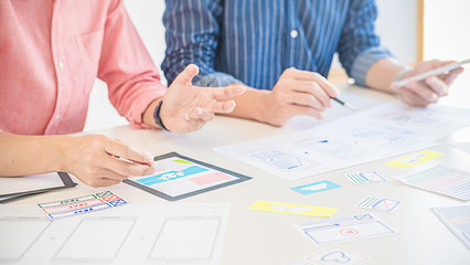 Creative Web Designer planning application and developing template layout, framework for mobile phone. User experience (UX) concept.