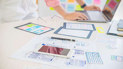 Creative Web Designer planning application and developing template layout, framework for mobile phone. User experience (UX) concept.