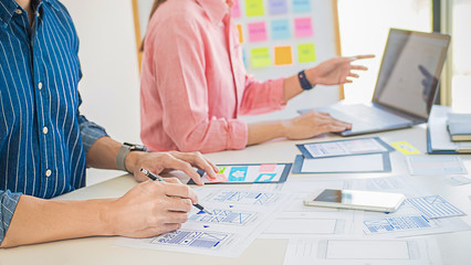 Creative Web Designer planning application and developing template layout, framework for mobile phone. User experience (UX) concept.