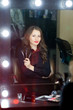© fotofrol - Beautiful girl makeup artist near mirrors