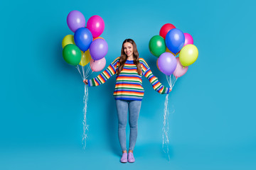 Wall Mural - Full length photo of charming content girl hold many balloons enjoy anniversary celebration wear good look mood clothes pullover isolated over blue color background