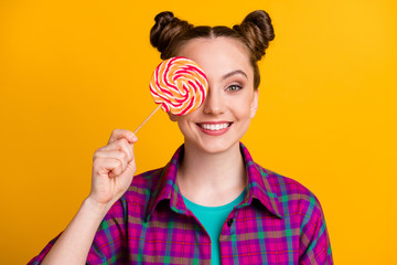 Sticker - Close-up portrait of her she nice attractive cheerful funky girl wearing checked shirt holding in hand striped lollypop closing eye isolated bright vivid shine vibrant yellow color background