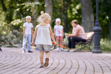 little girl is sad in the park.