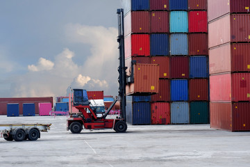 Empty container handler with side spreaders in the yard.