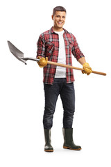 Poster - Male gardener in boots holding a shovel