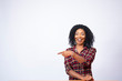 © Confidence - excited pretty black lady pointing to the space to her side