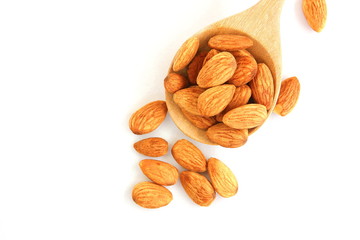 group of brown almond seed high vitamin on wooden spoon isolate on white background.