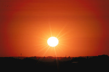 Wall Mural - red sunset over a rural landscape