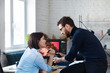© YURII MASLAK - Photographer and graphic designer working in office with laptop, monitor, graphic drawing tablet and color palette. Creating team discussing ideas in advertising agency. Retouching images. Teamwork.