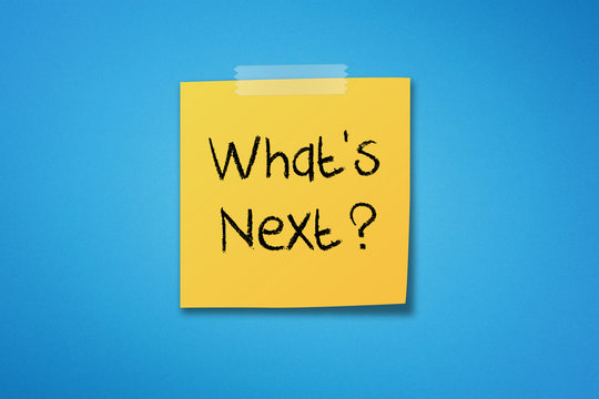 Yellow sticky note paper with what's next on blue background	