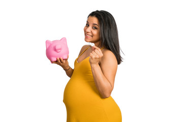 Pregnant woman saving money to her newborn baby.