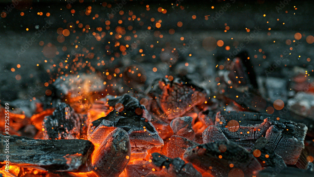 Barbecue Grill Pit With Glowing And Flaming Hot Charcoal Briquettes, Close-Up - obrazy, fototapety, plakaty 