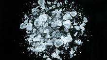 Crushed Ice In Motion, Isolated On Black Background.