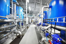 Large Blue Tanks In A Industrial City Water Treatment Boiler Room. Wide Angle Perspective. Special Equipment, Technology, Drinking Water Supply, Chemical Modifications, Environmental Conservation