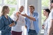 © opolja - Team of colleagues brainstorming together while working in office