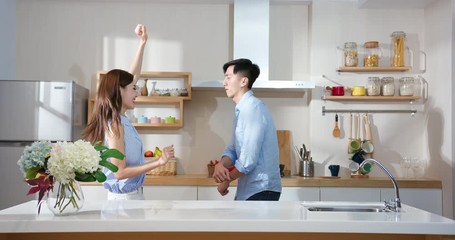 Wall Mural - couple dance in kitchen happily