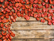 dry tomatoes on a wooden background